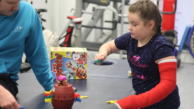 Child undertaking CIMT treatment.