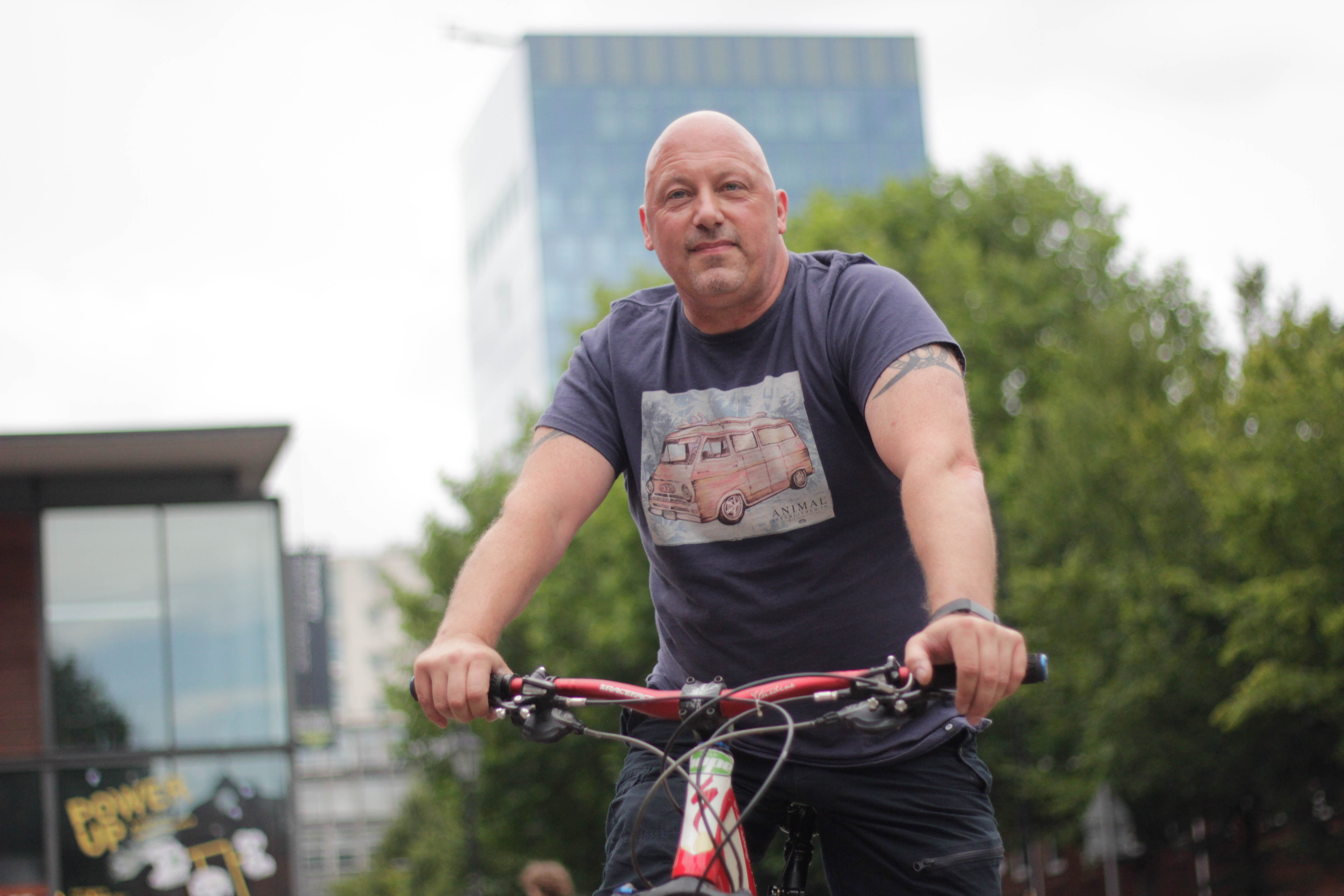 Man sat on bike.