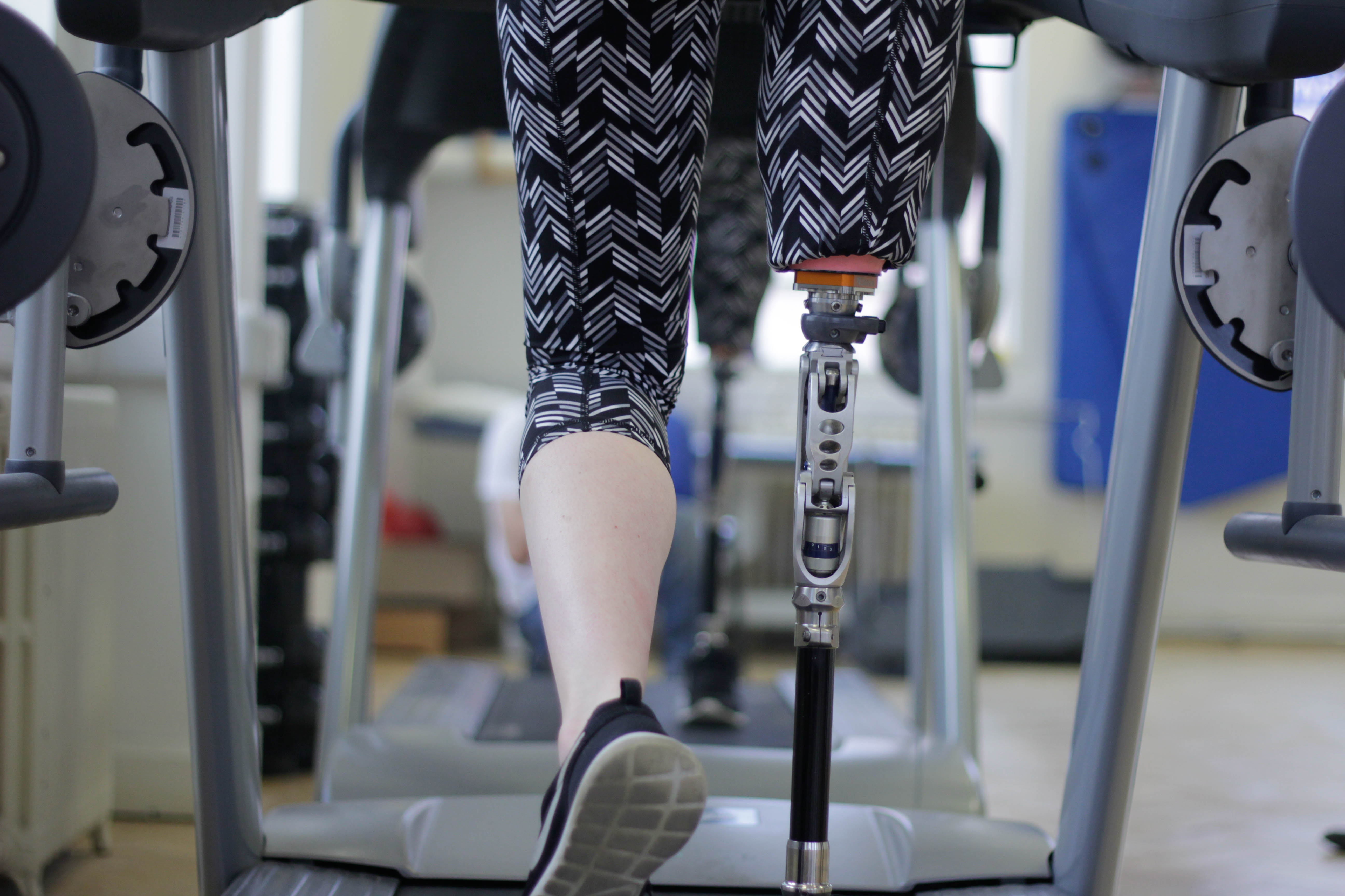 Lady training on treadmill.