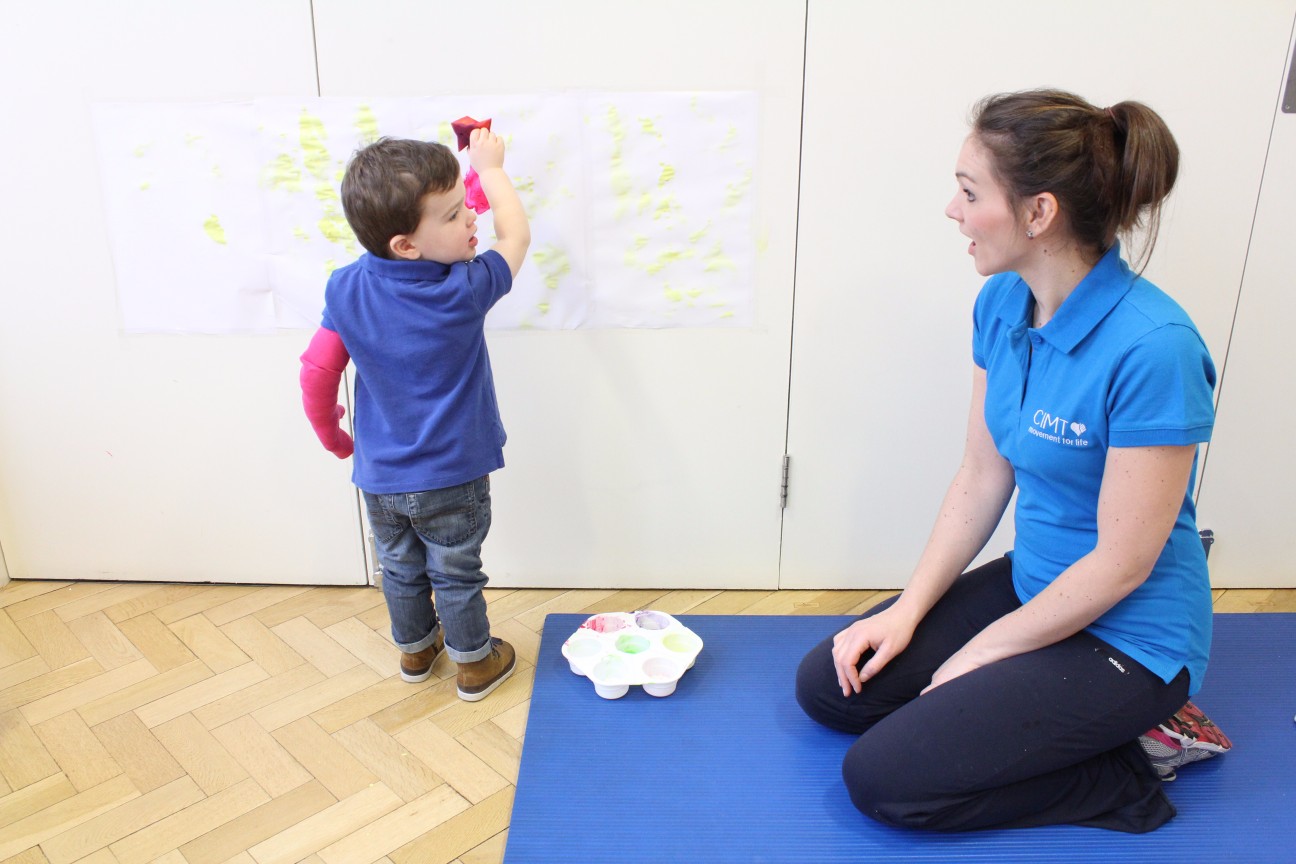 Therapist working with child.