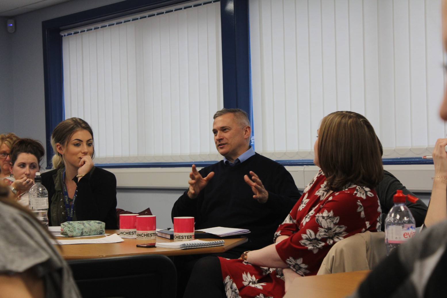 Discussion around a table.