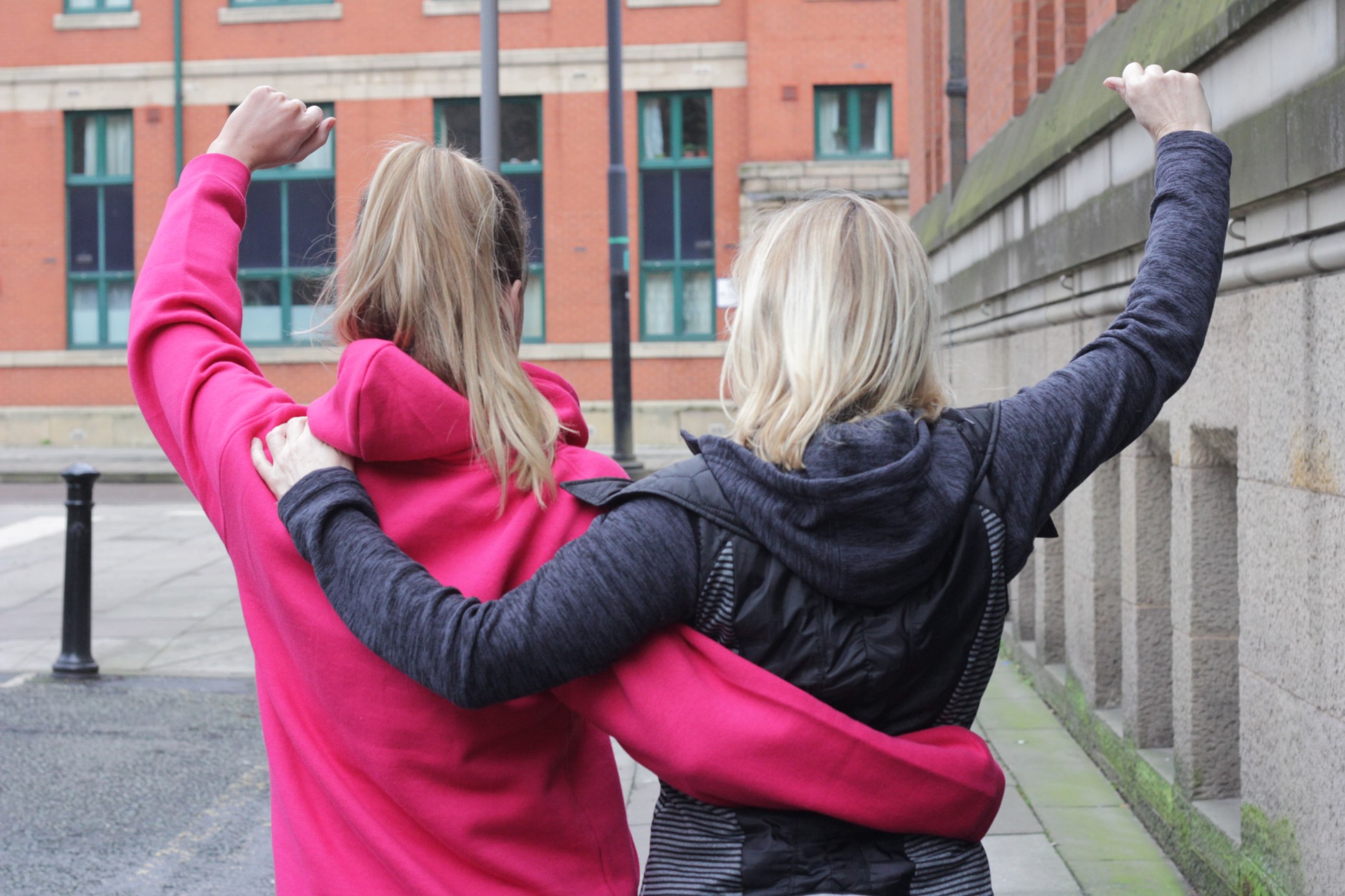 Two girls cheering.