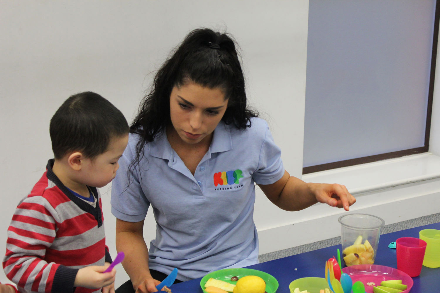 Kids Feeding Team clinican working with patient.