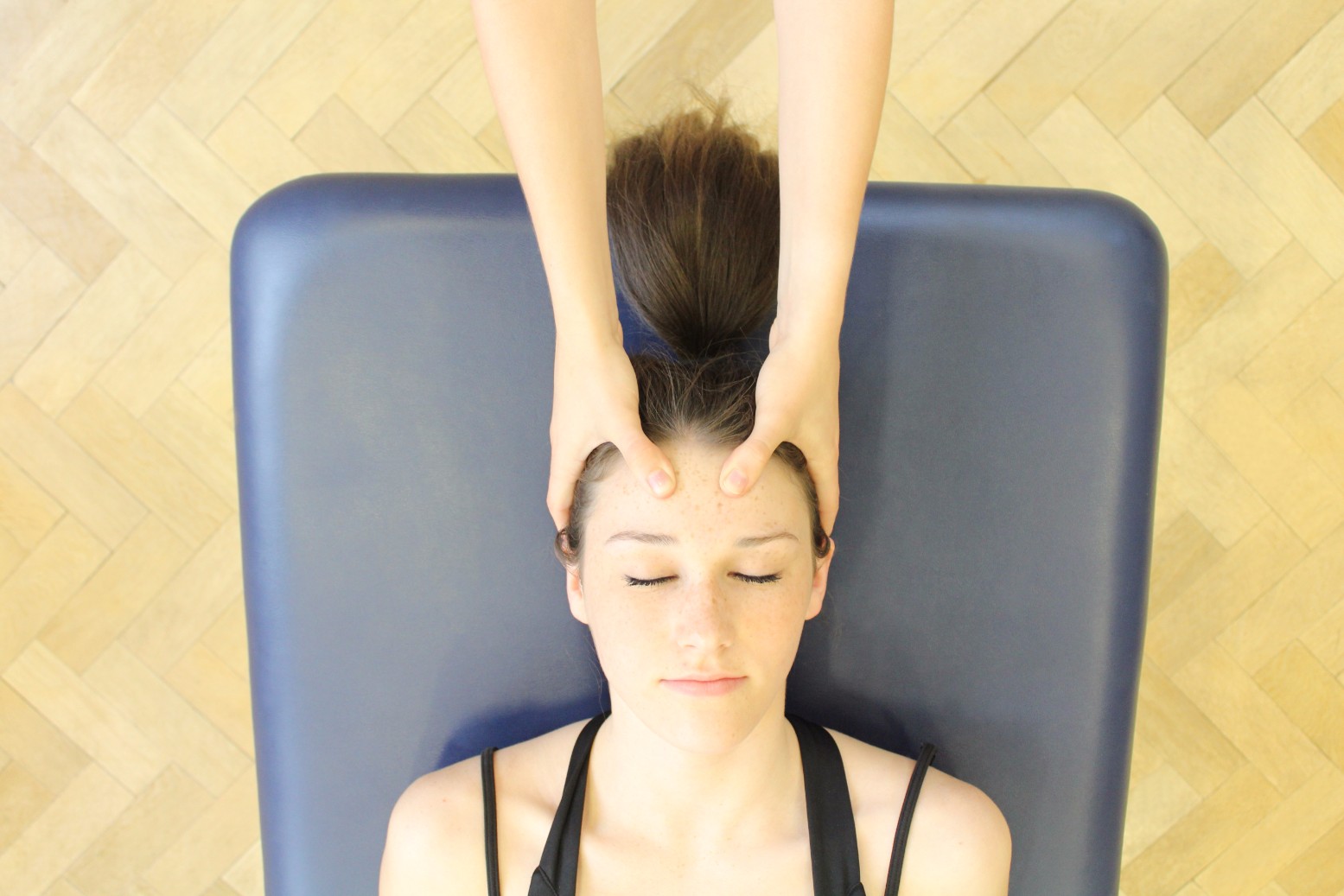 Client receiving head massage.