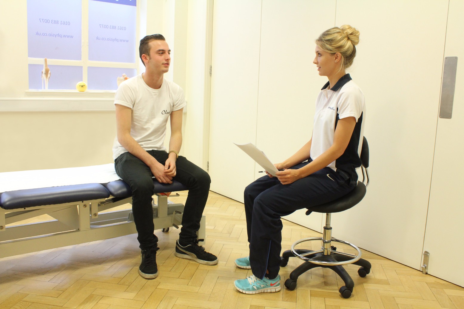 Patient sitting down for assessment.