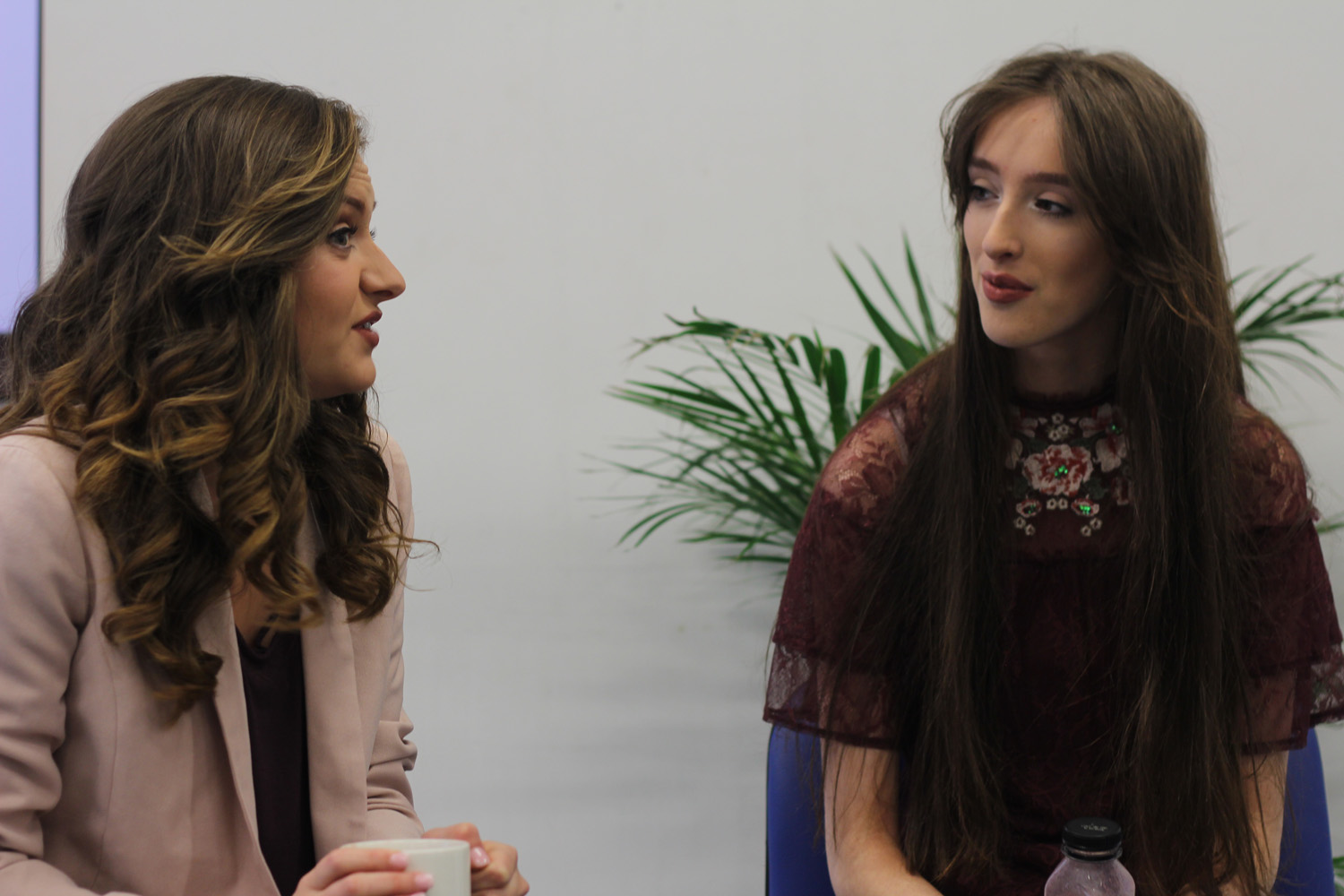 Two girls having a conversation.