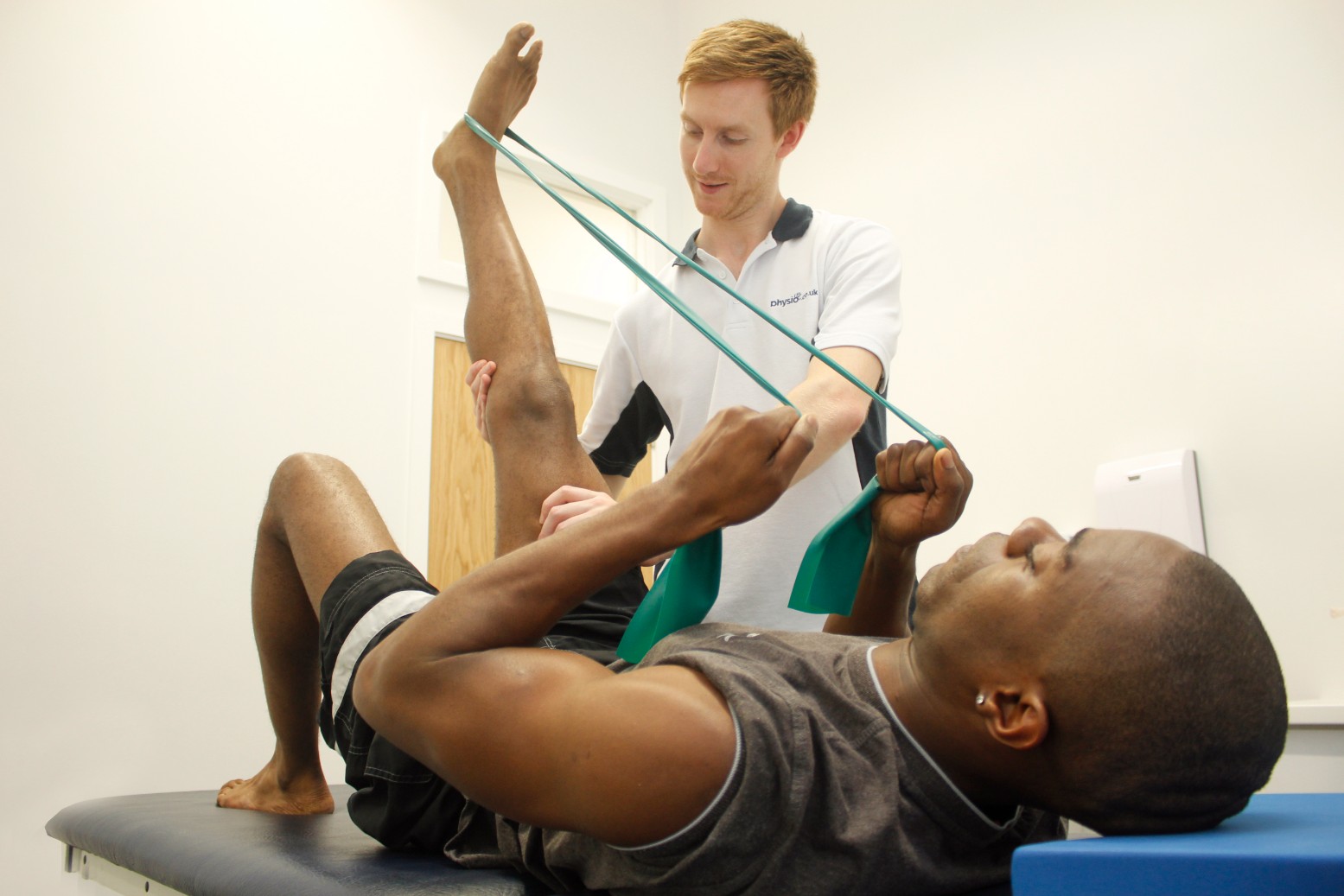 Client doing a leg raise.