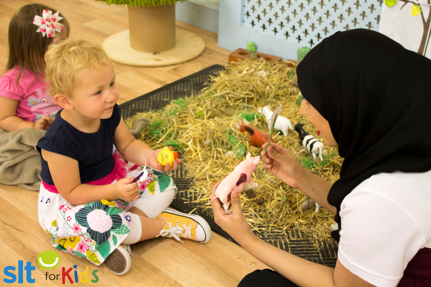 Little girl in a pretend farm.