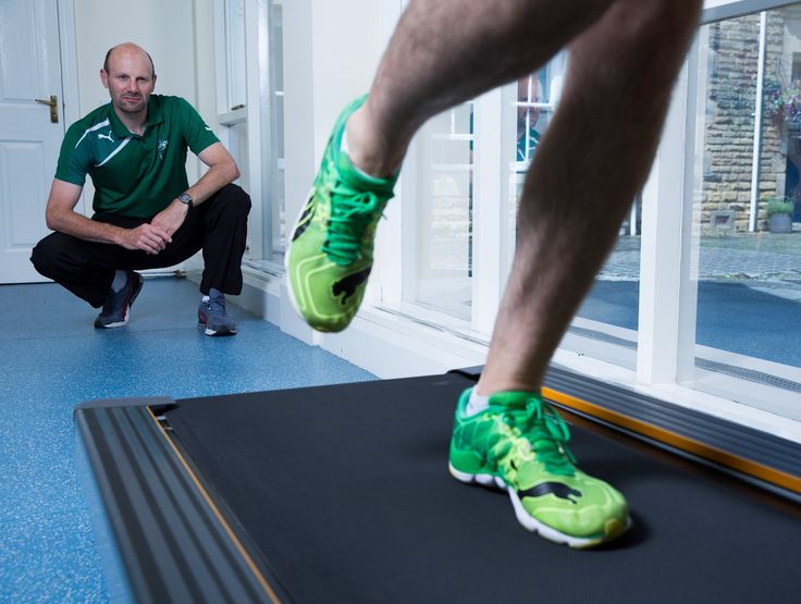 Specialist judging a runner's gait.