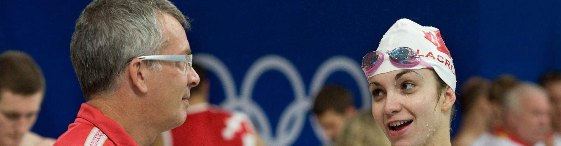 Swimmer smiling at her coach.