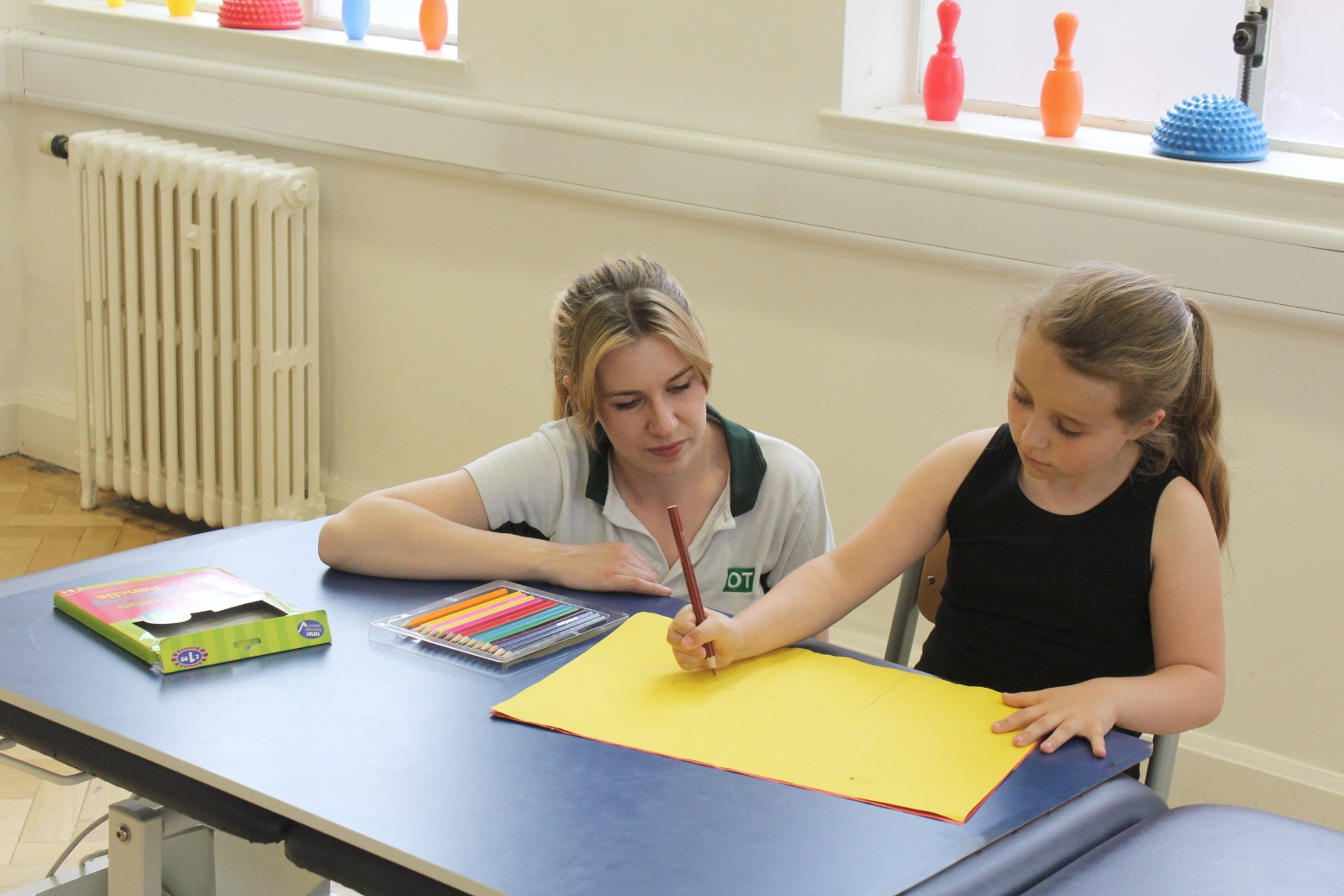 Therapist working with patient.